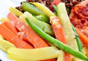 carrots, green beans, yellow beans, and zucchini in miso-butter