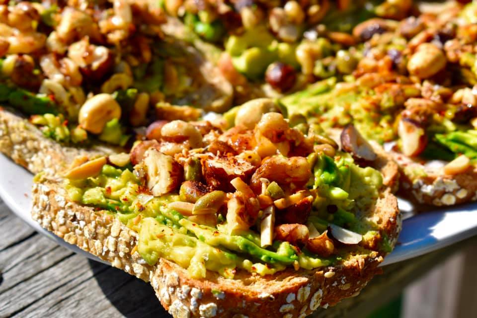 toast with smashed avocado and nuts