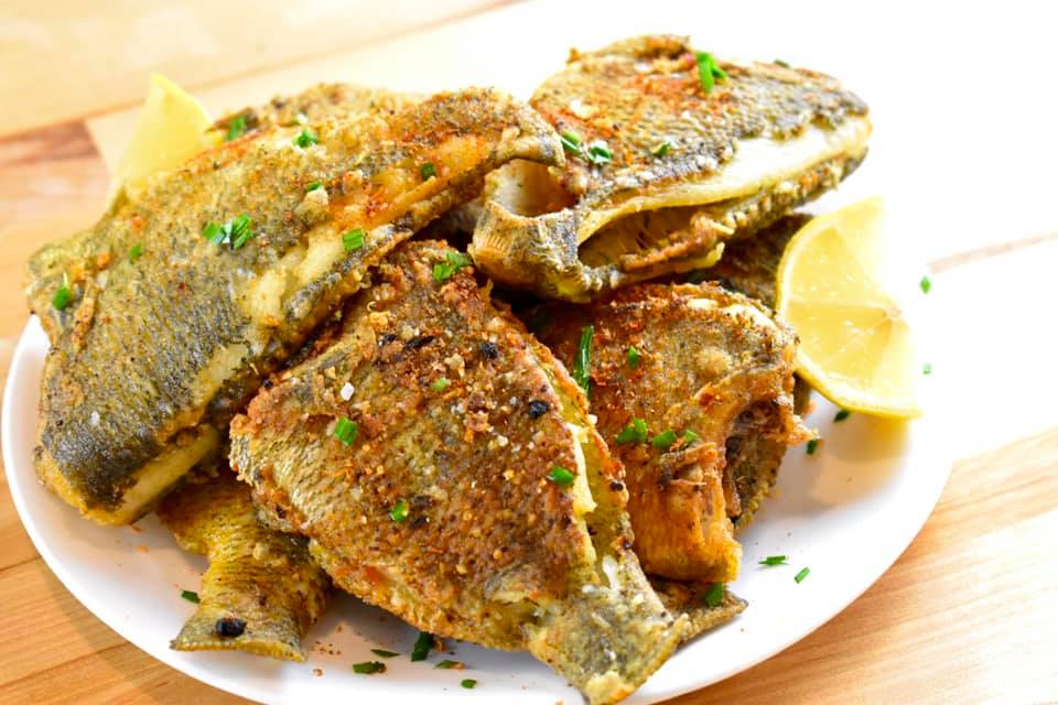 plate piled with fried panfish