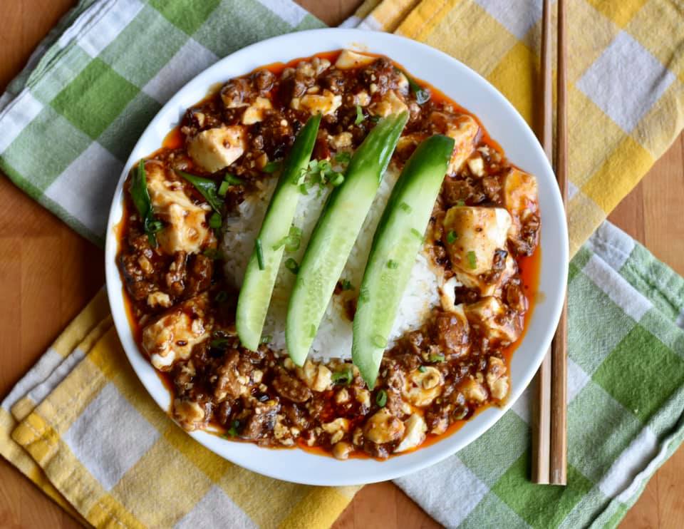 mapo tofu on rice with cucumber slices