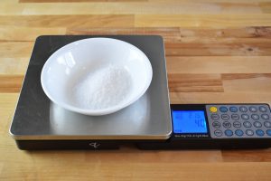 Kosher salt being weighed to 40 grams