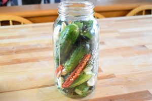 Ingredients stacked into jar without liquid