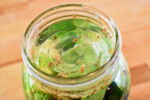 Jar with ingredients and glass weight to hold them down