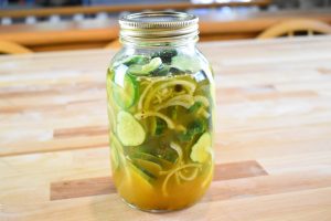 Sliced pickles in jar