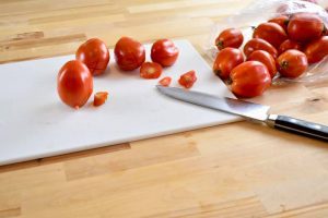 plum tomatoes with the stem ends cut off