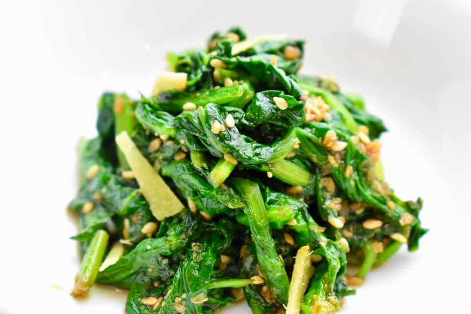 blanched spinach dressed in sesame sauce