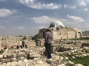 man standing on ruins