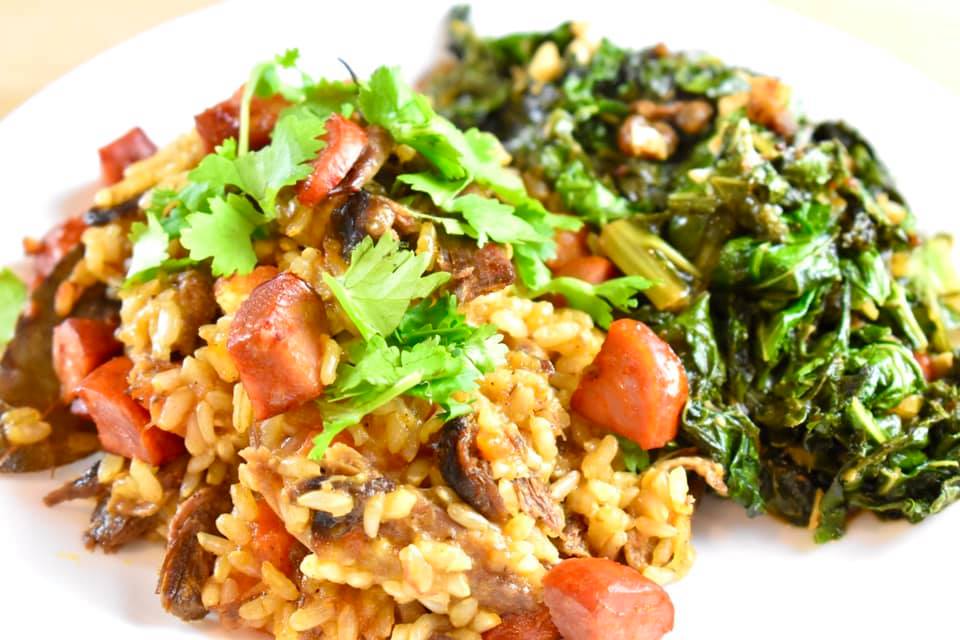 Portuguese duck rice with sauteed kale