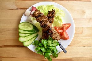 grilled beef skewers with fresh vegetables