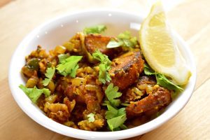 eddoes masala with a lemon wedge