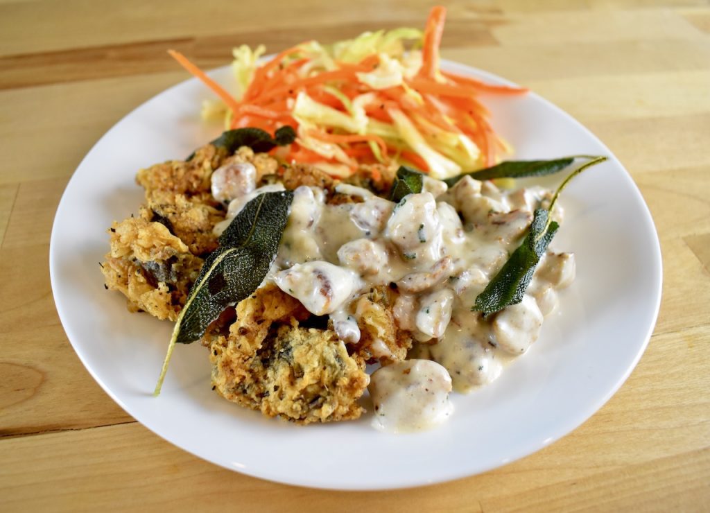 country fried goose gizzards with sausage gravy and salad