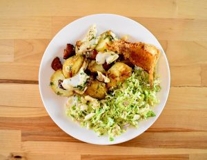 Portuguese-style walleye and potatoes with brussels slaw