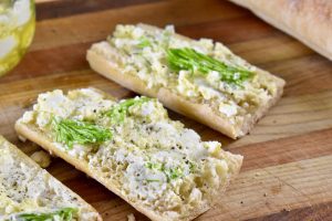 goat cheese spread on baguette