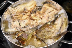 simmering roasted pike heads and bones