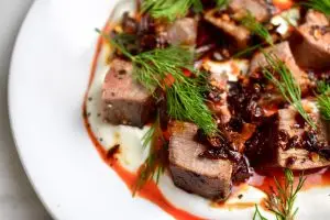 venison steak salad with yogurt, chili crisp, and dill